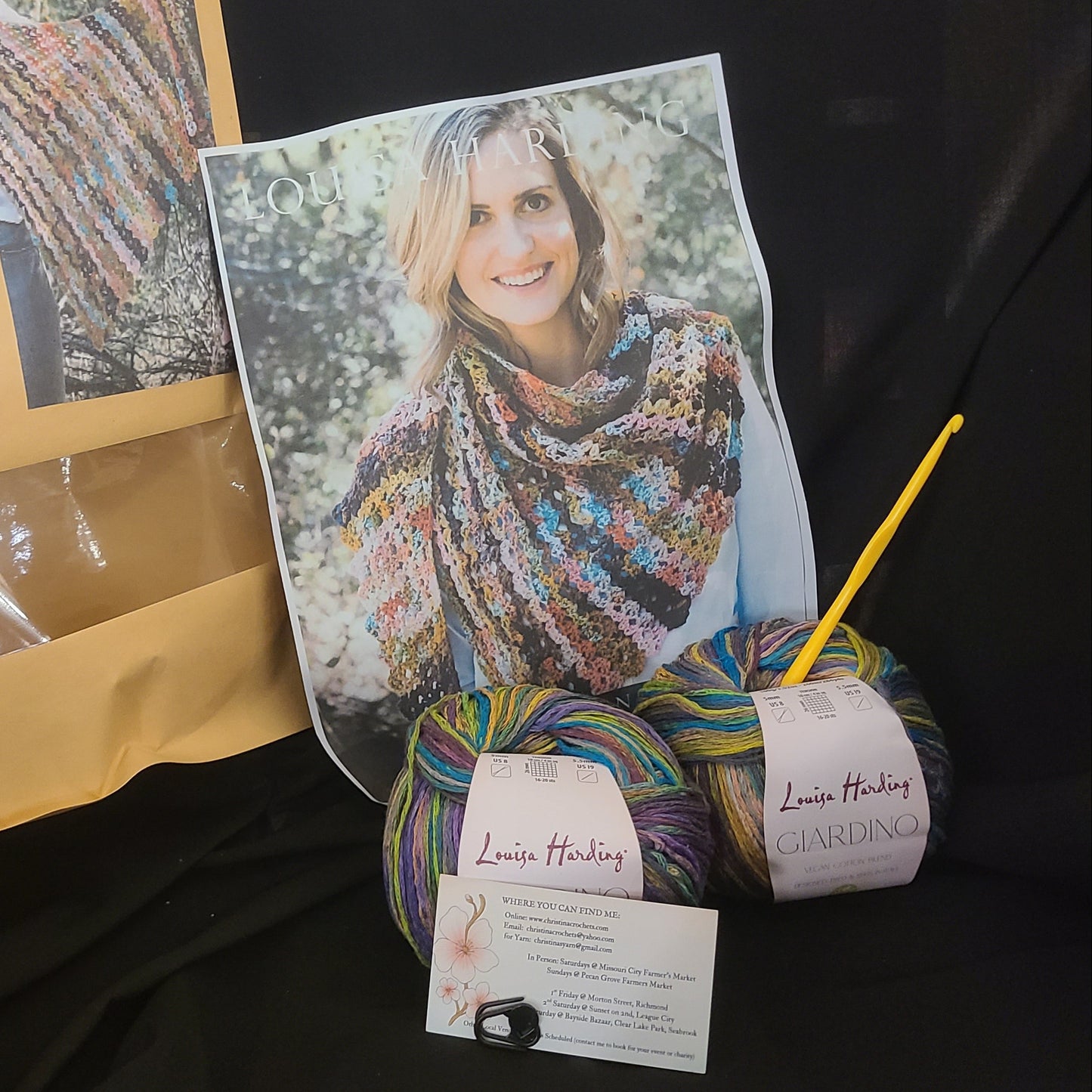 Yarn with a patterned card and envelope on a black background