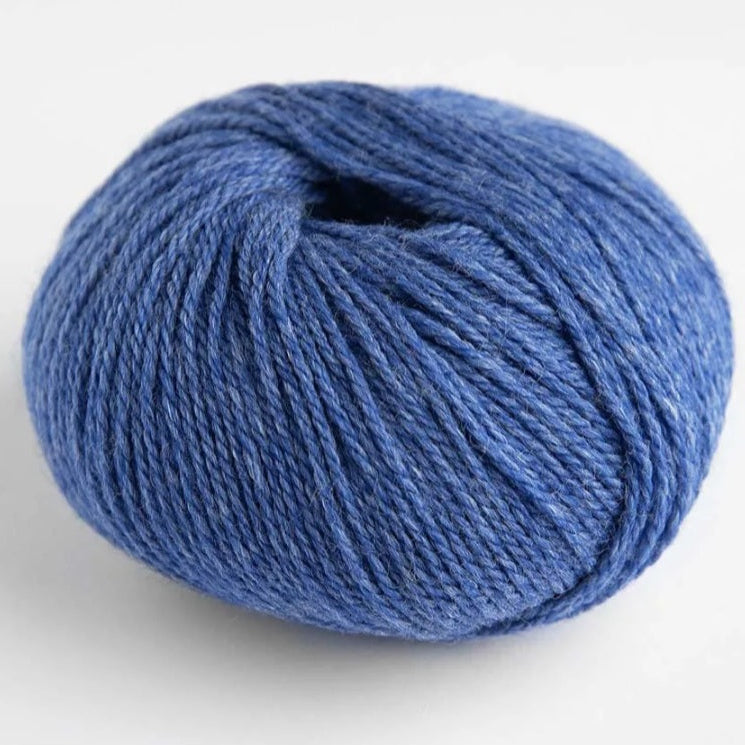 Blue skein of yarn on a white background