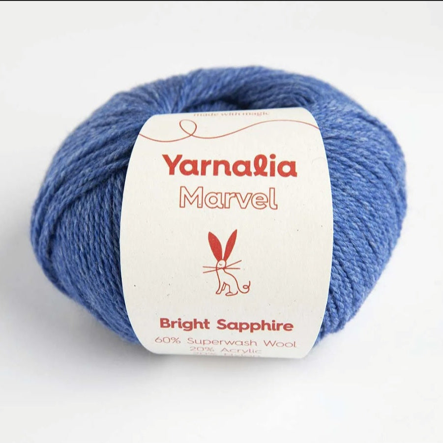 Blue skein of yarn with a 'Yarnalia Marvel' label on a white background
