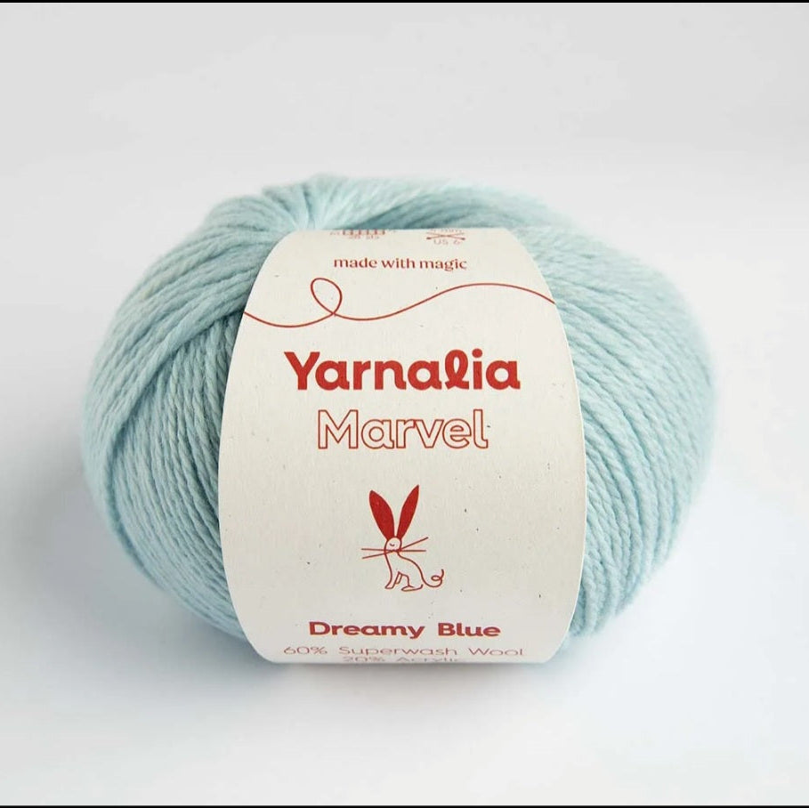 Ball of yarn with 'Yarnalia Marvel' label on a white background