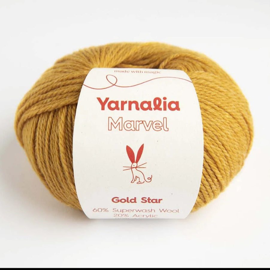 Ball of yellow yarn with a 'Yarnalia Marvel' label on a white background
