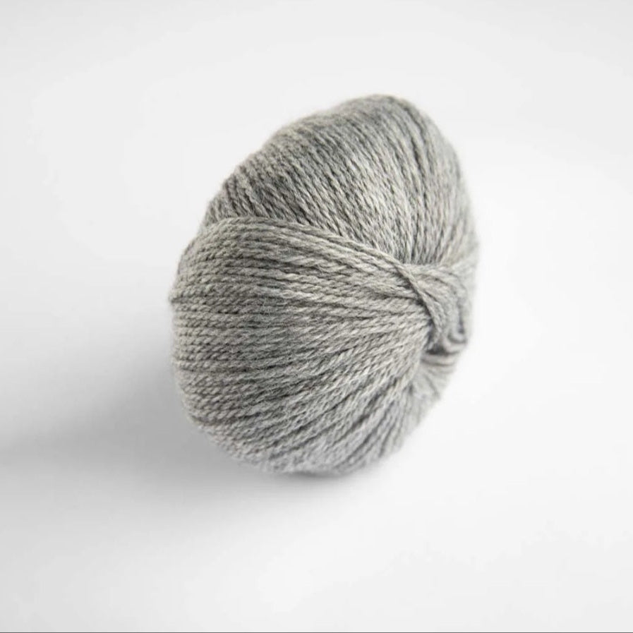 Gray skein of yarn on a white background