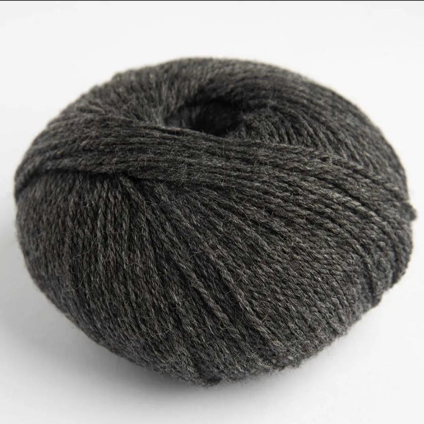 Gray skein of yarn on a white background
