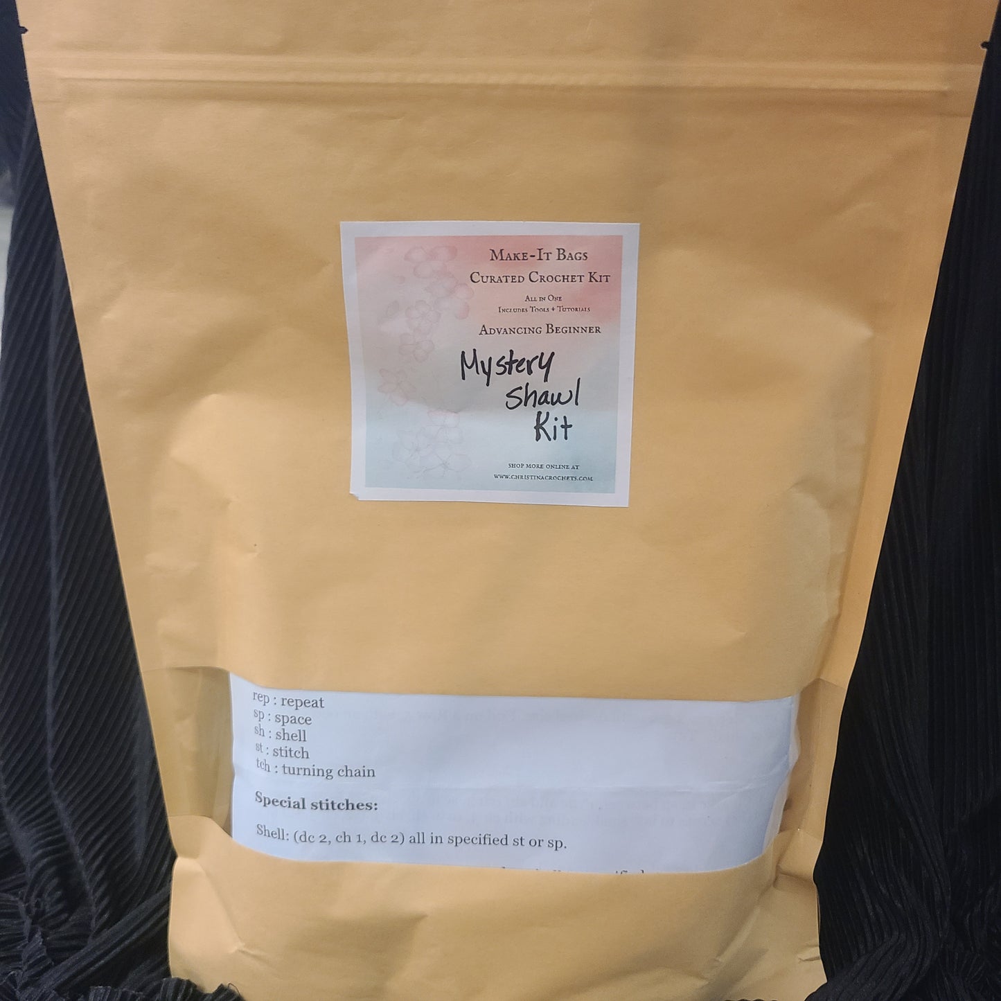Kraft paper package with a label on a black background