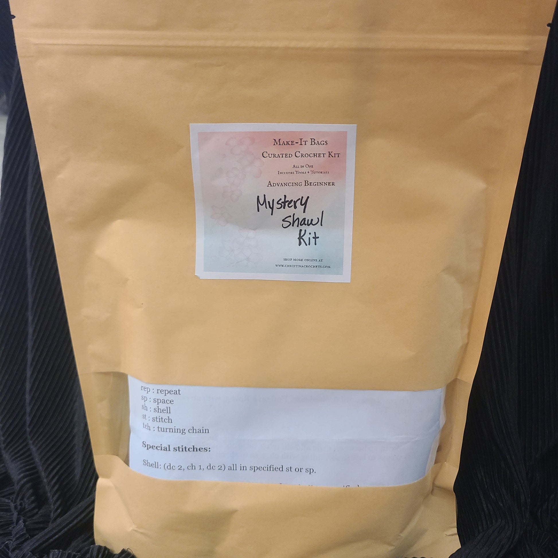 Kraft paper package with a label on a black background