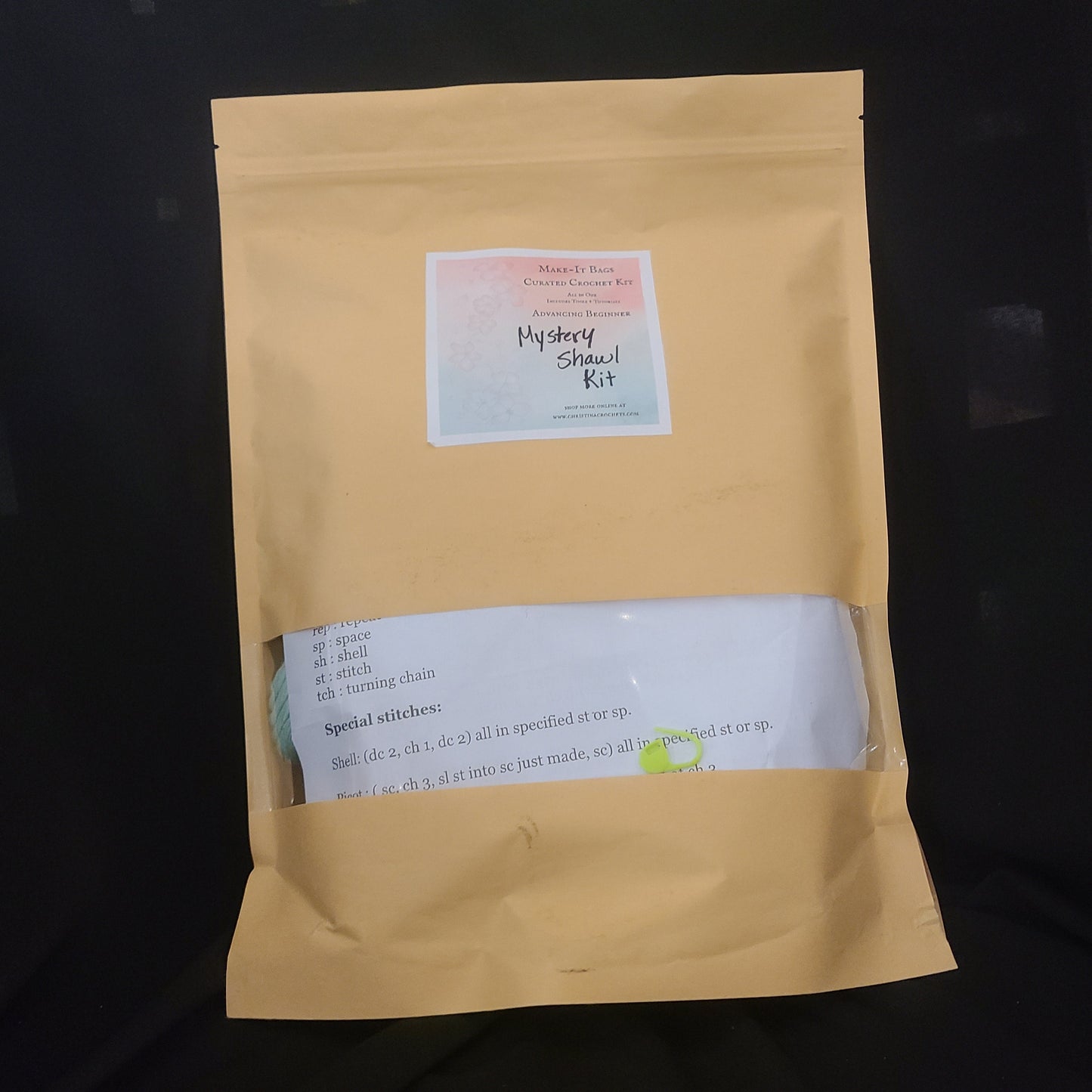Yellow envelope with a label on a black background
