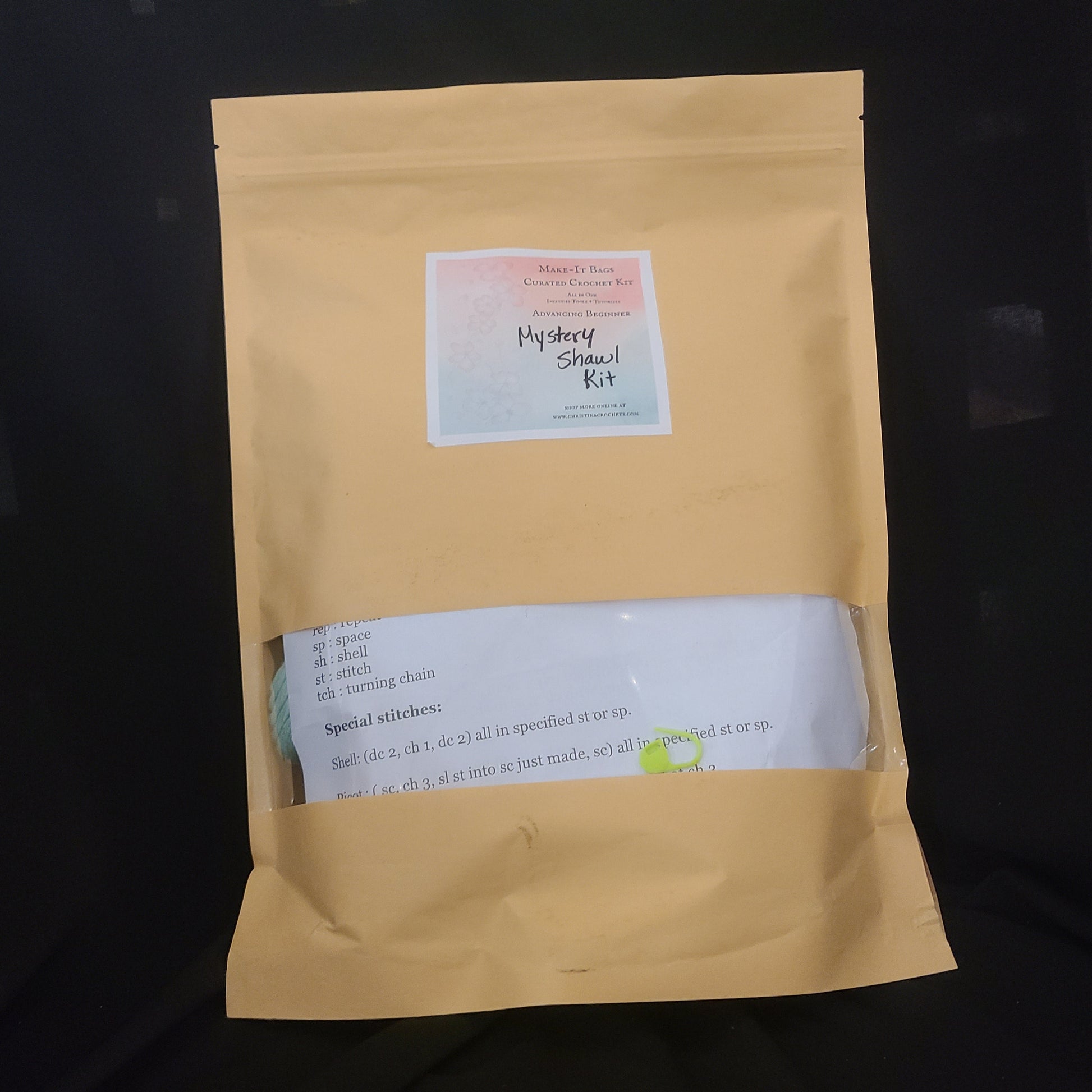 Yellow envelope with a label on a black background