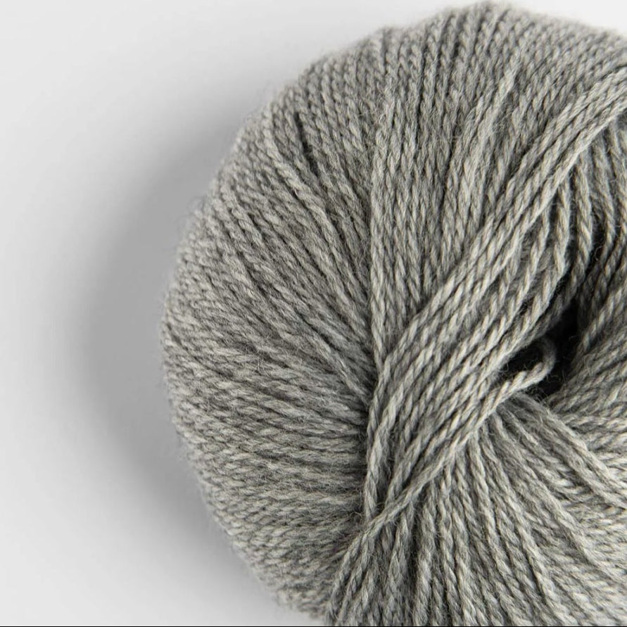 Gray skein of yarn on a light gray background