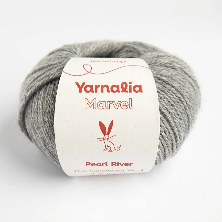Gray skein of yarn with a 'Yarnalia Marvel' label on a white background