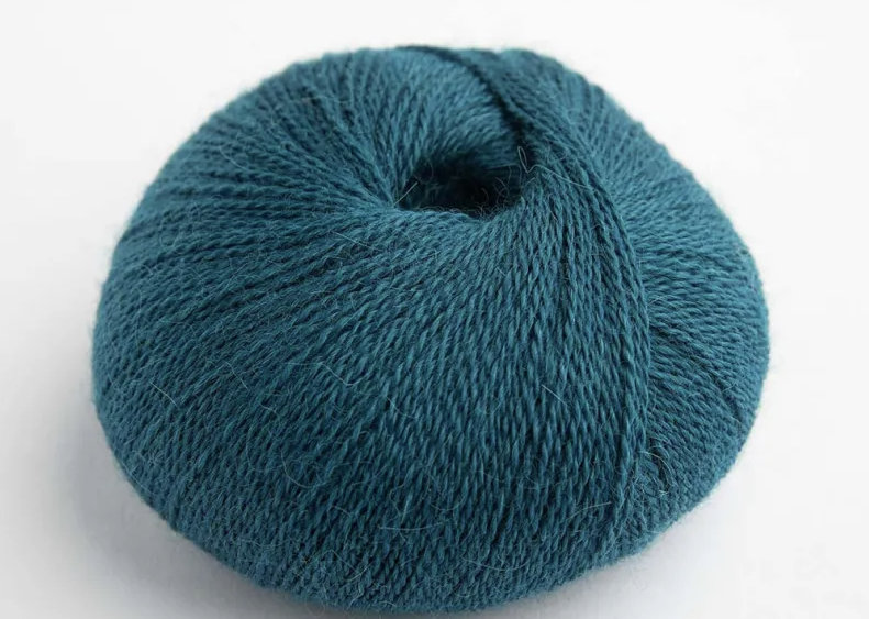 Blue skein of yarn on a white background