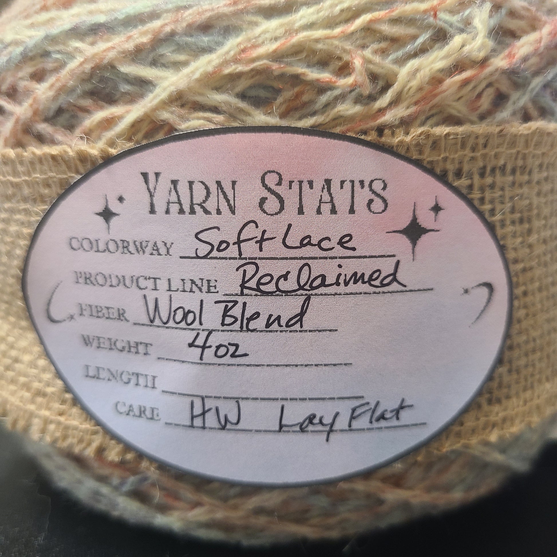 Yarn ball with a label on a dark background