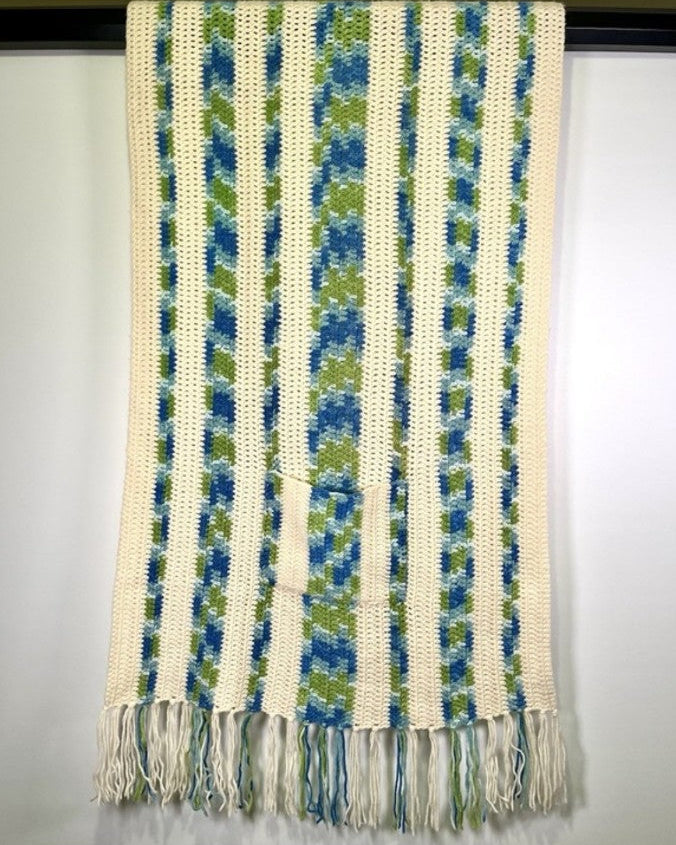 Textured fabric with blue and green stripes on a white background