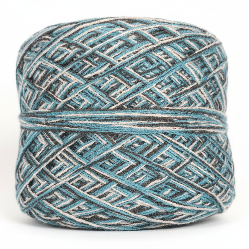 Ball of yarn with a geometric pattern on a dark background