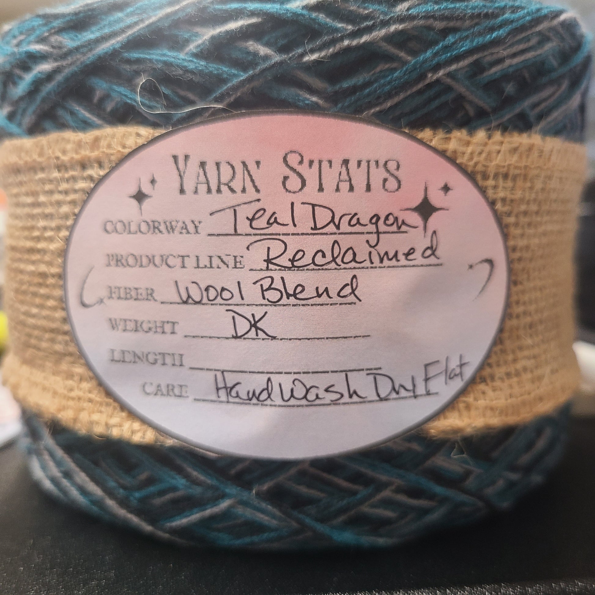 Yarn ball with a label on a dark background