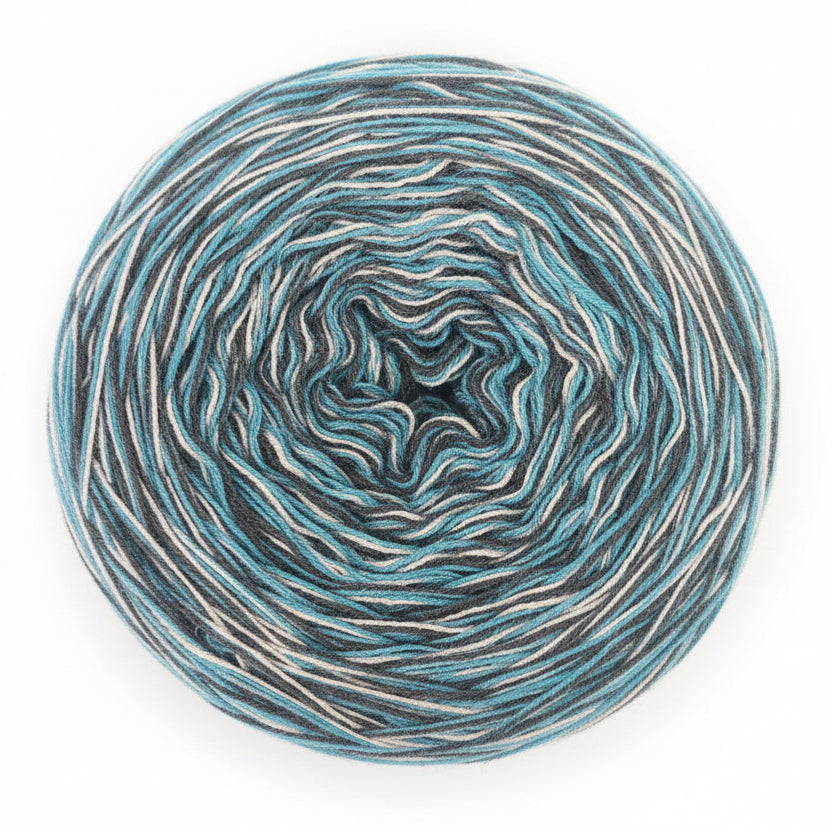 Coiled skein of yarn with blue and gray tones on a textured brown background