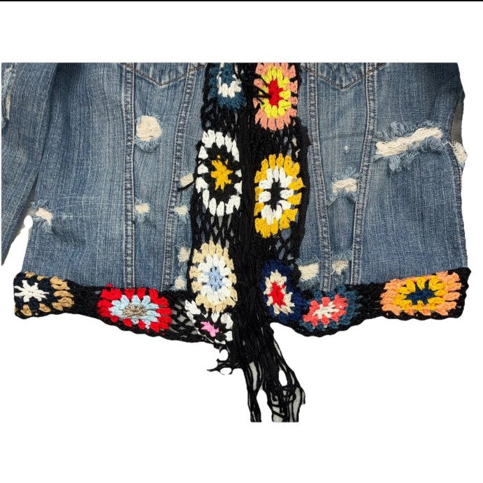 Close-up of crochet trim on vintage denim jacke