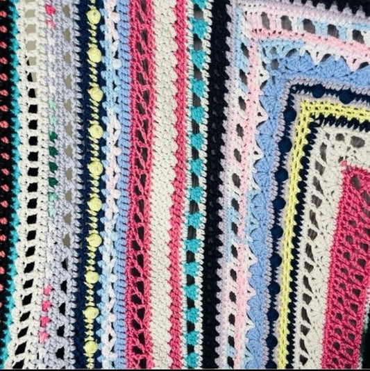 Textured stitch detail on one-of-a-kind vintage crocheted blanket