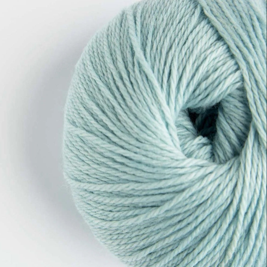 Light blue skein of yarn on a white background