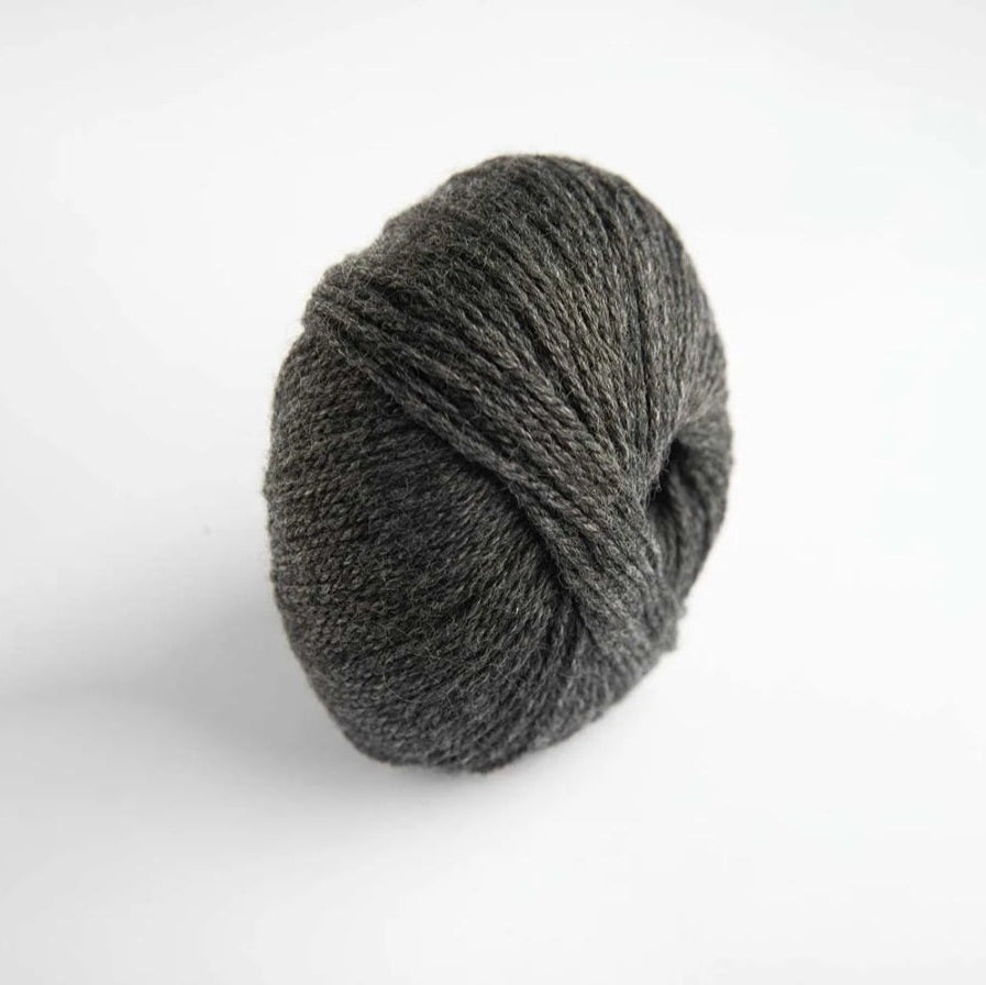 Gray skein of yarn on a white background