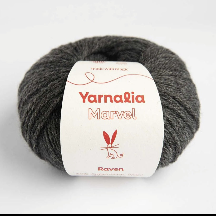 Ball of gray yarn with a 'Yarnalia Marvel' label on a white background