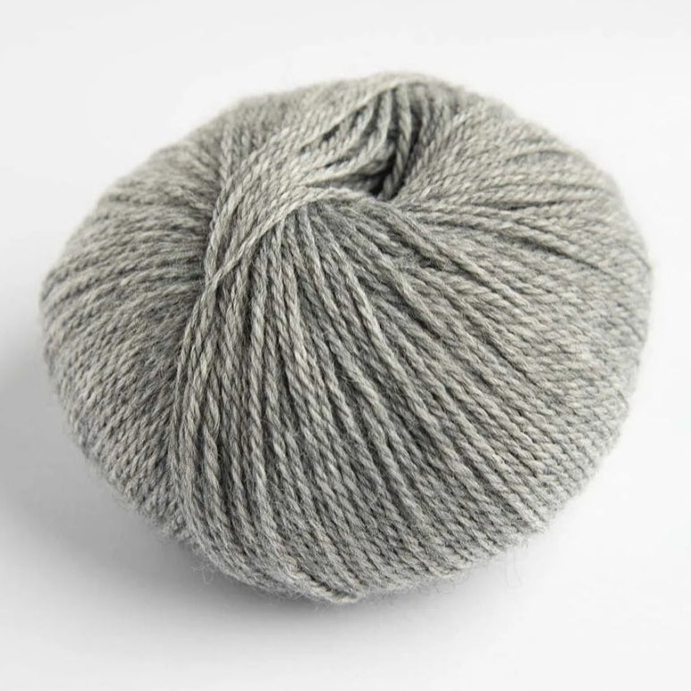 Gray skein of yarn on a white background