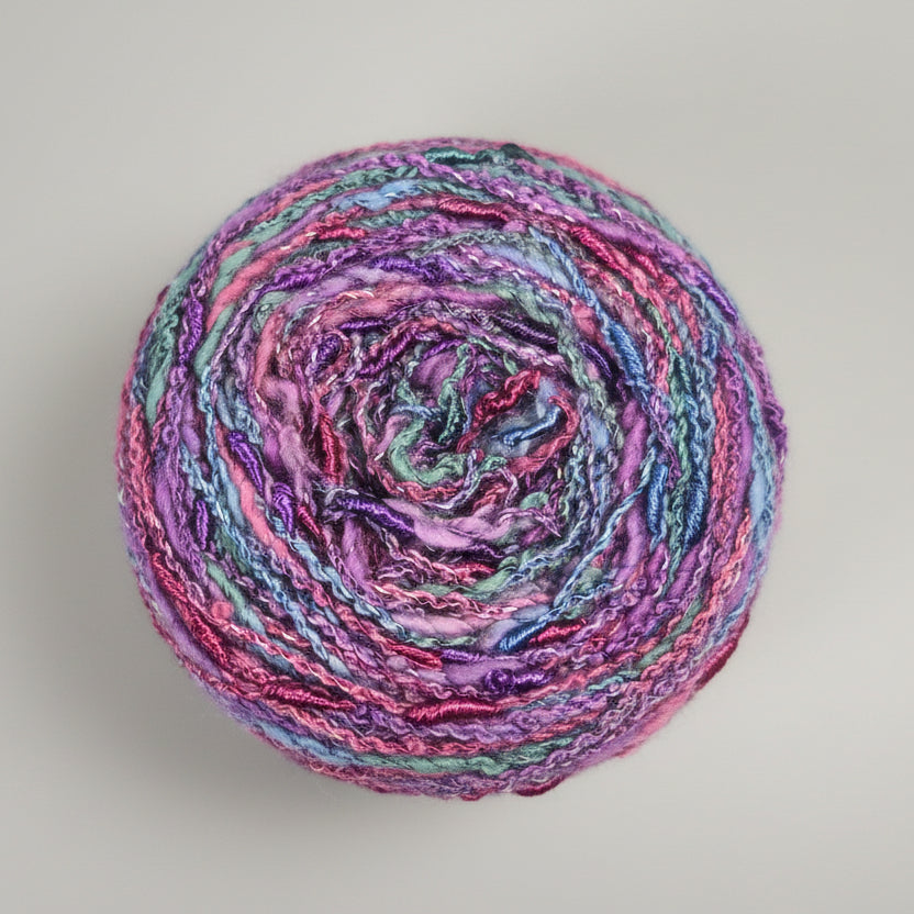 Multicolored skein of yarn on a white background