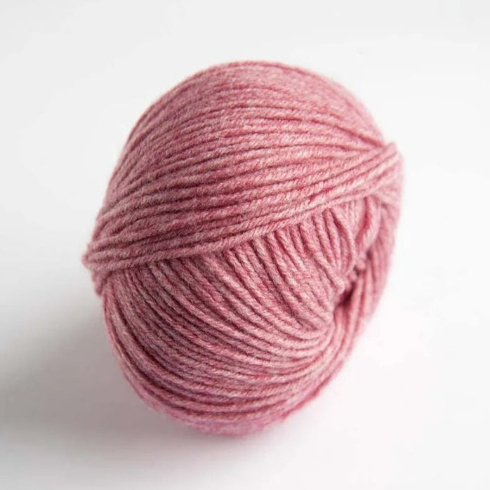Pink skein of yarn on a white background