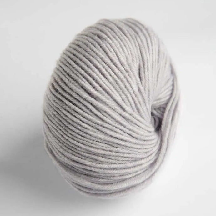 Gray skein of yarn on a white background
