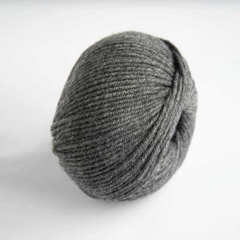 Gray skein of yarn on a white background