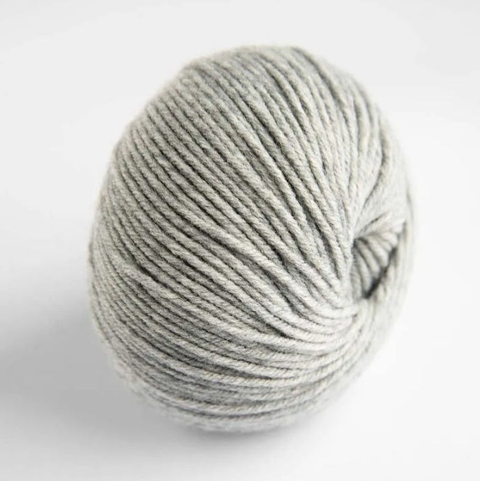 Ball of gray yarn on a white background